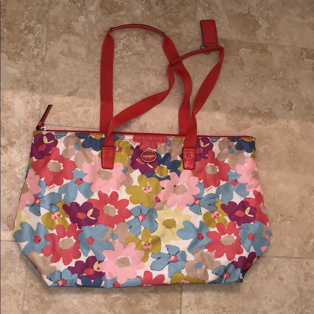 Coach tote bag with detachable cosmetic bag.